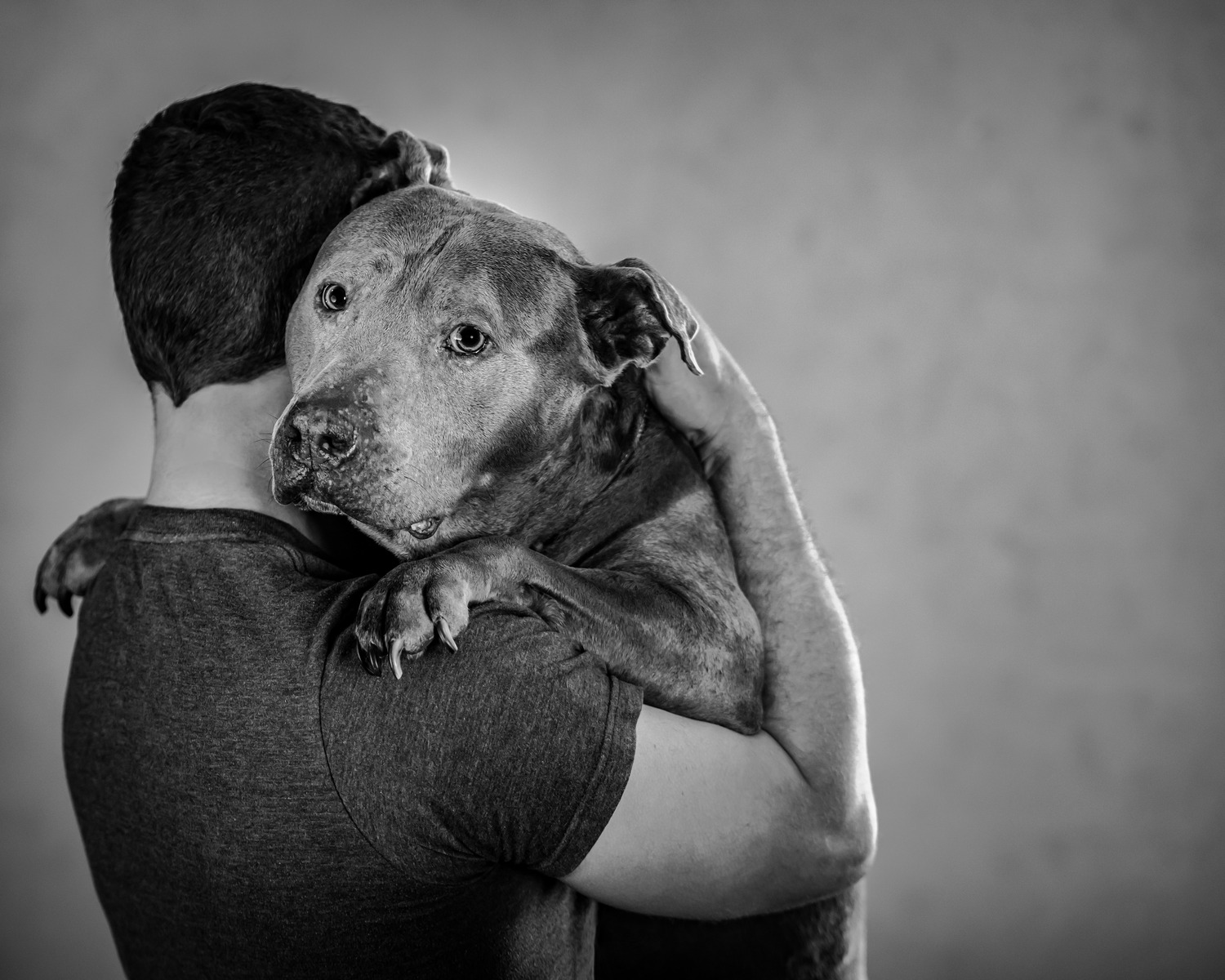 Black and white pictures for South Florida of a guy and his doggy..